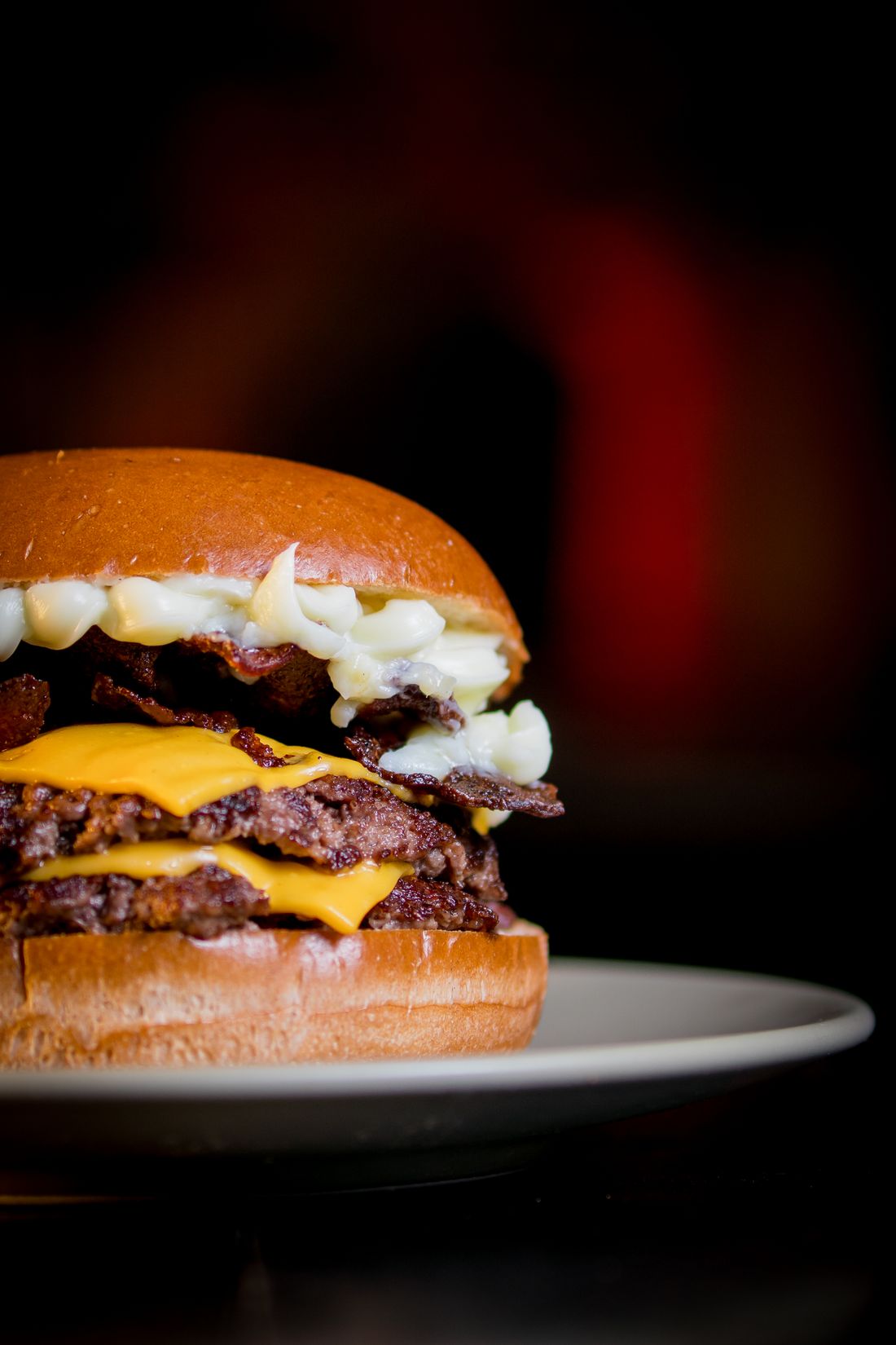 Finished cheeseburger with melted cheese and brioche bun