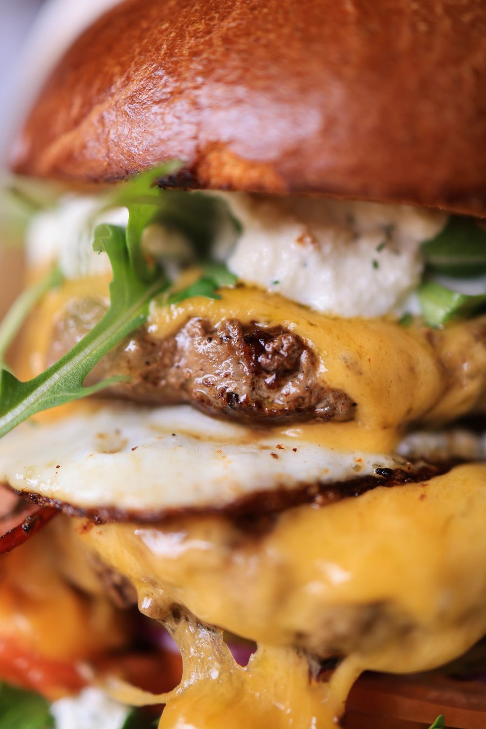 Gourmet cheeseburger with melted cheese and toppings