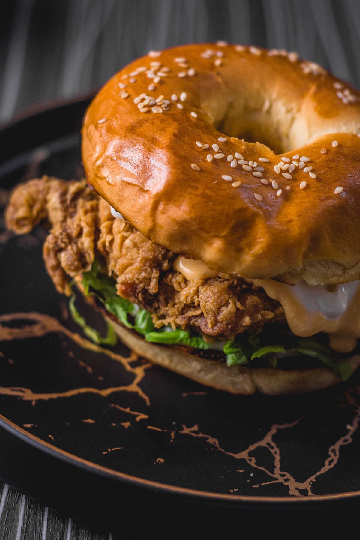 Gourmet chicken burger with melted cheese and toppings