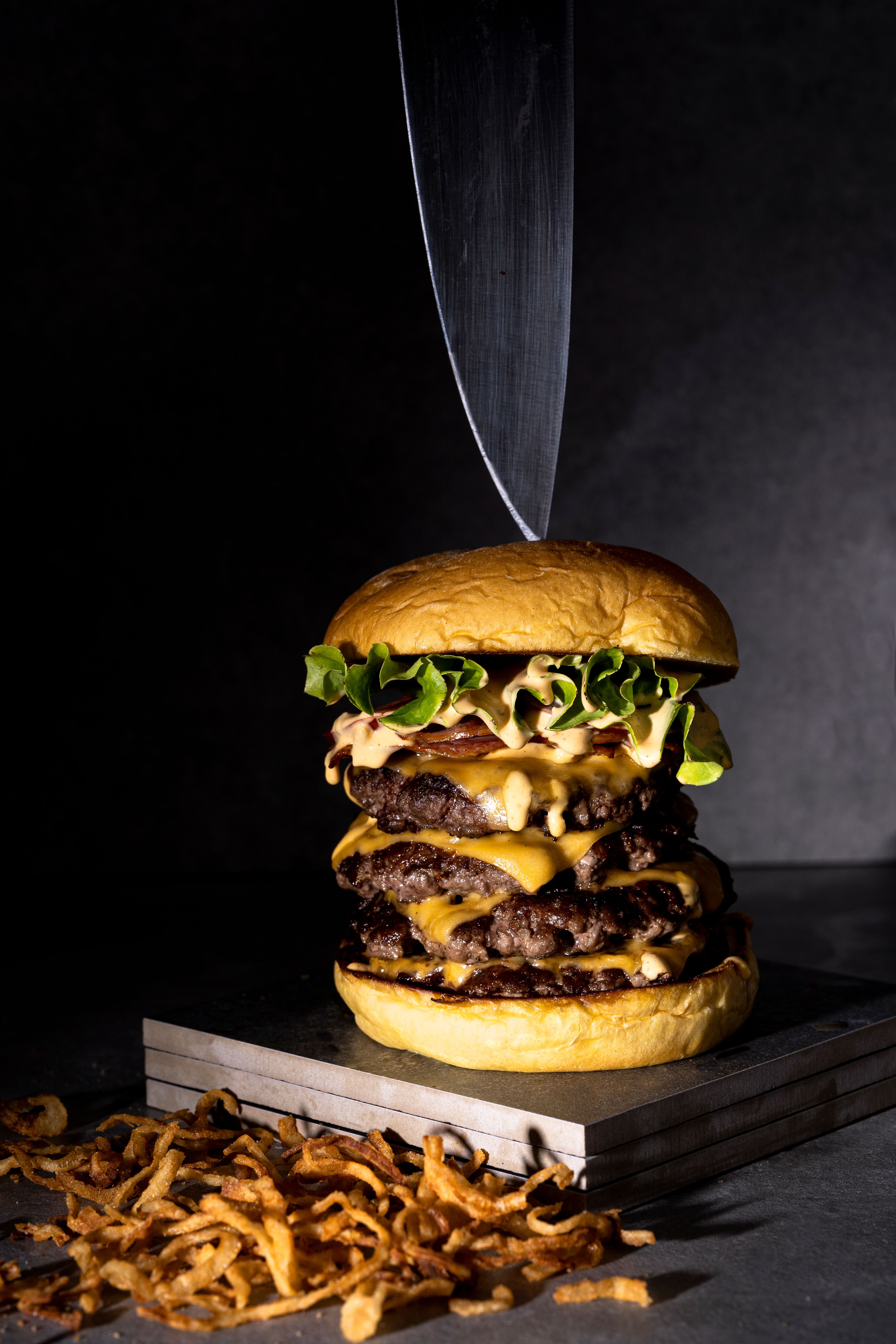 Loaded burger with melted cheese layers