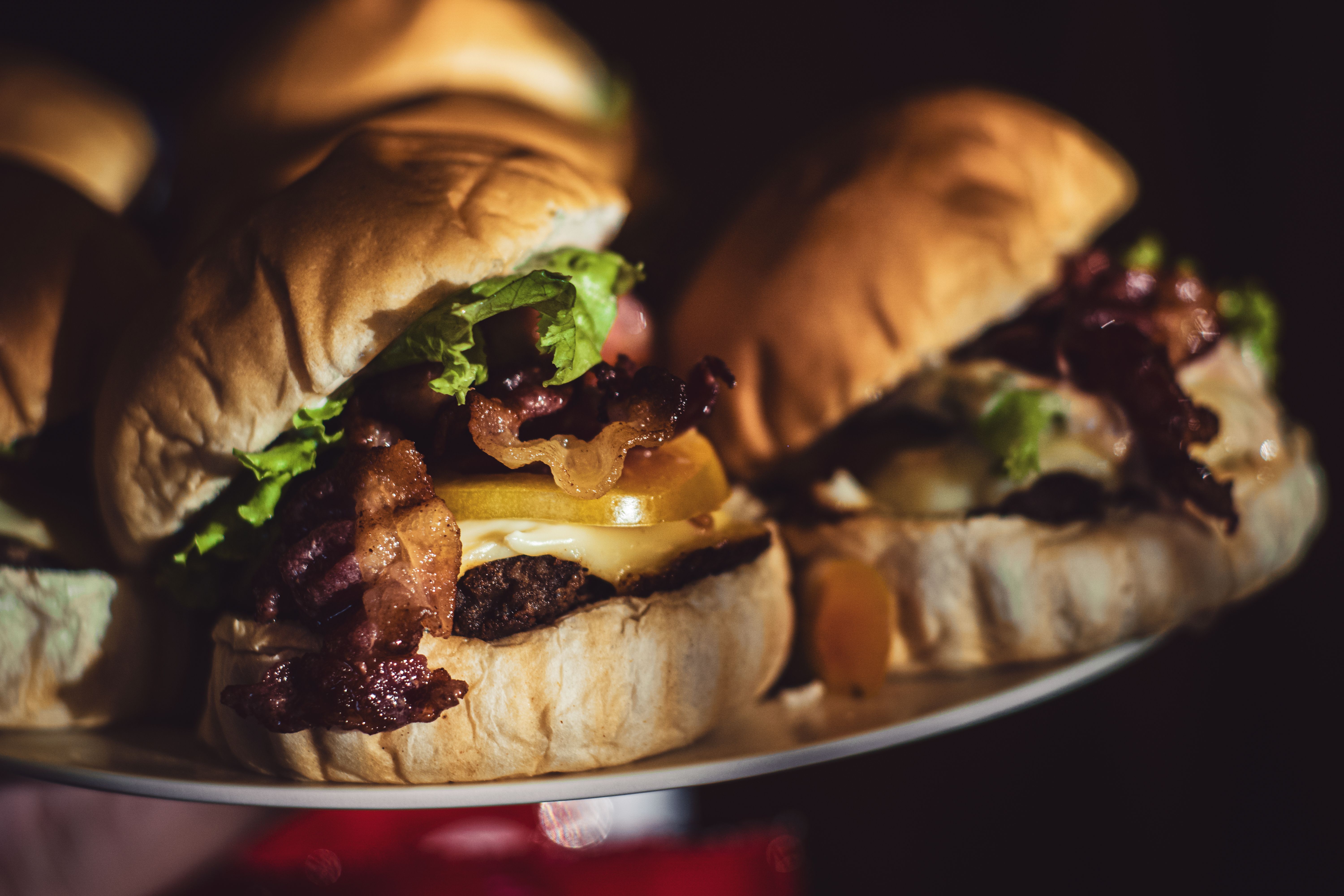 Loaded burger with bacon cheese and layered toppings