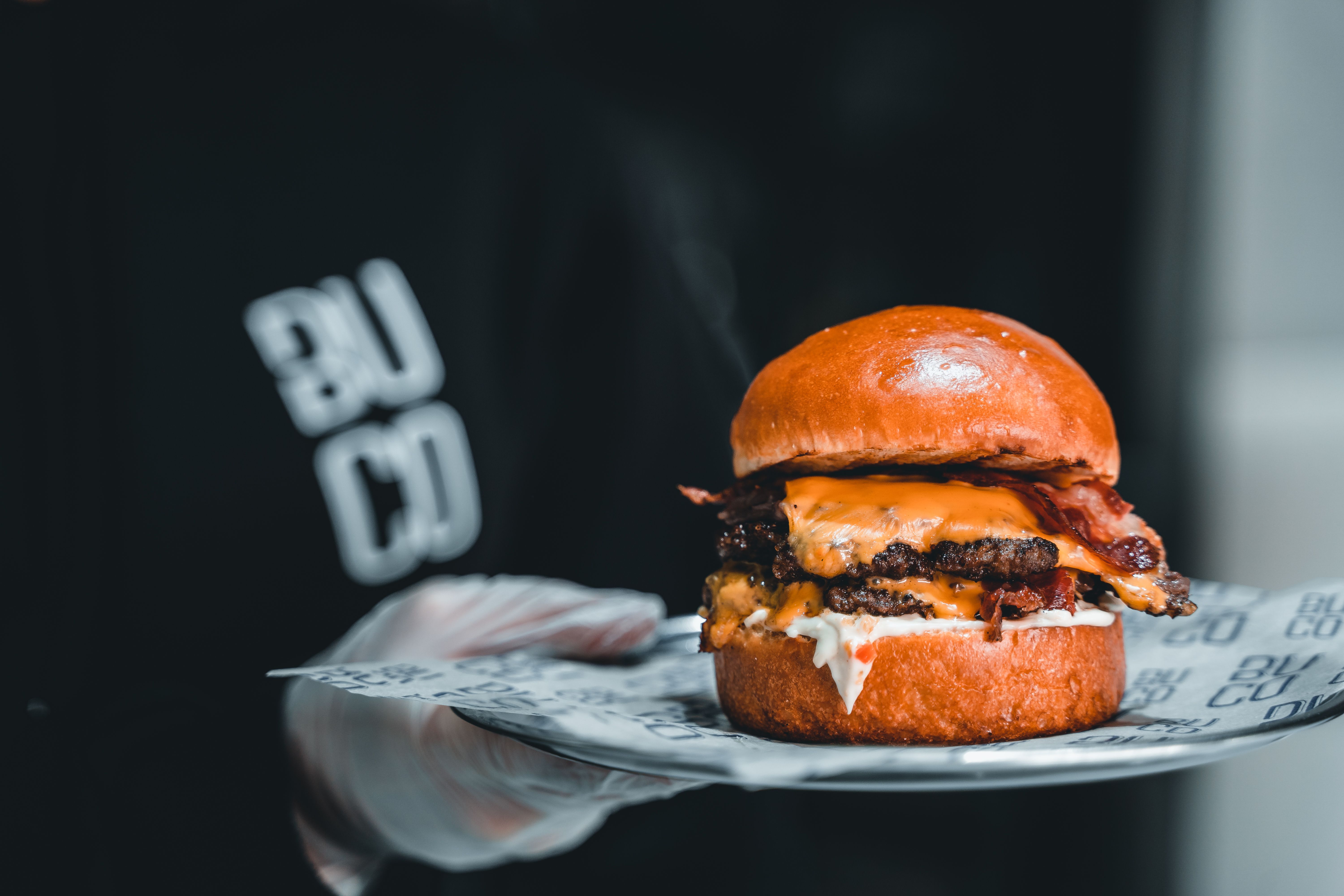 Loaded cheeseburger with melted cheese between patties