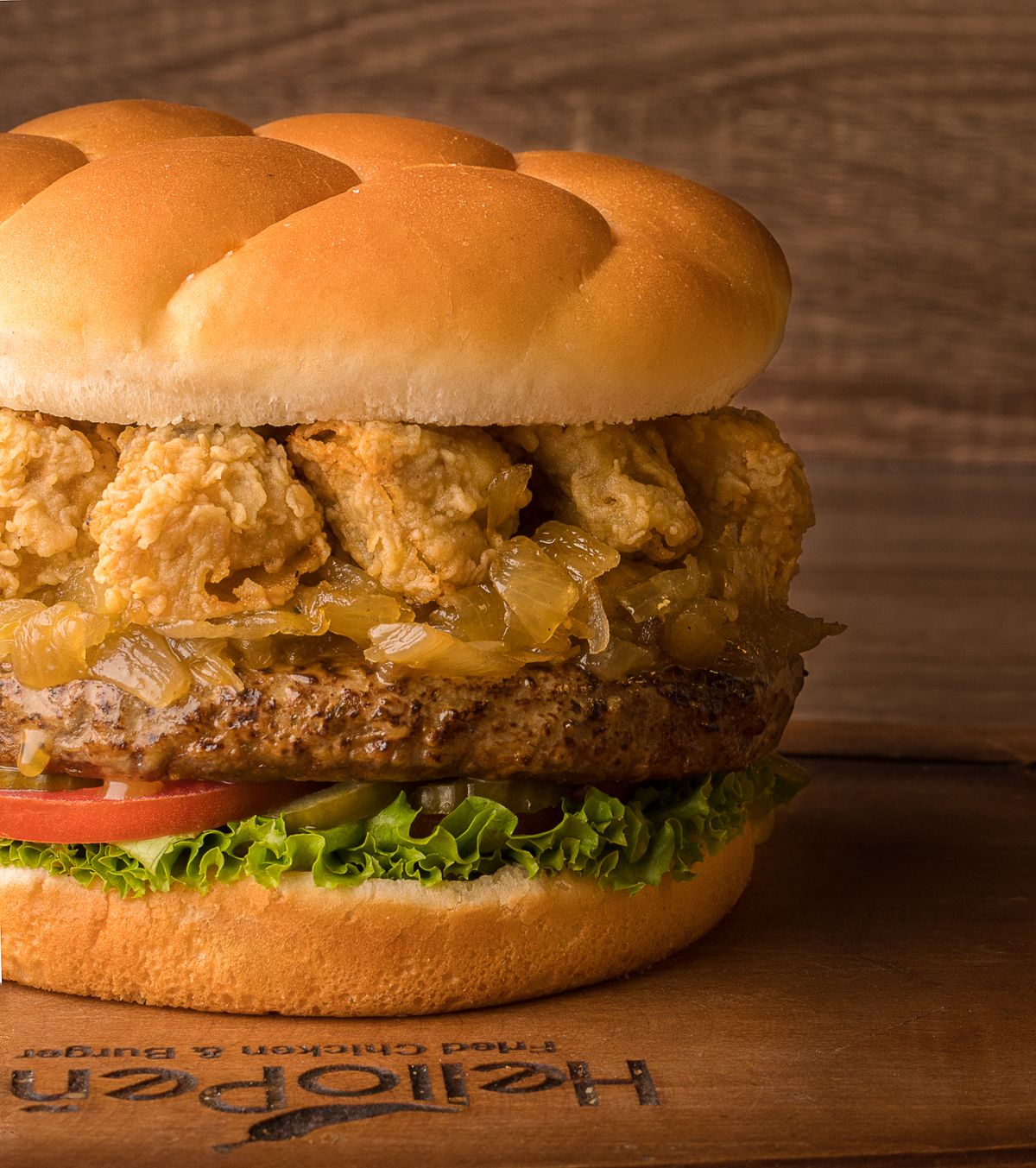 Spicy Burger with ketchup on dark plate