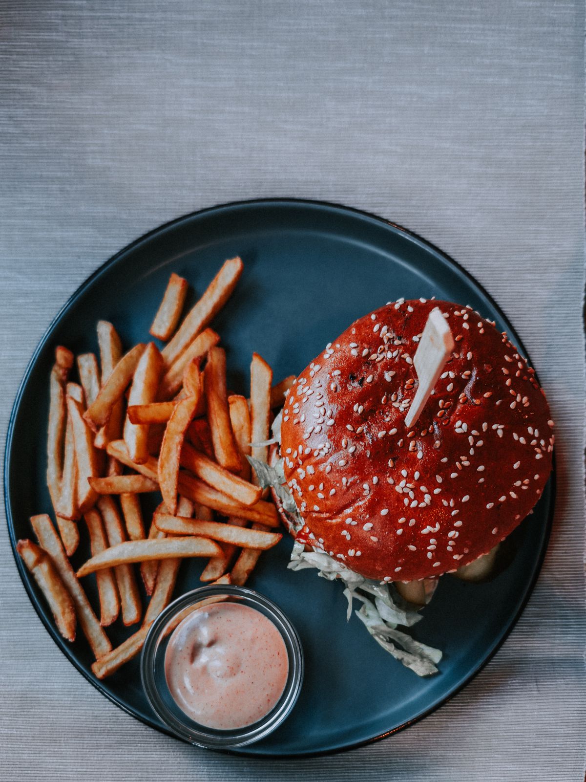 Beef burger patty cooking in a skillet