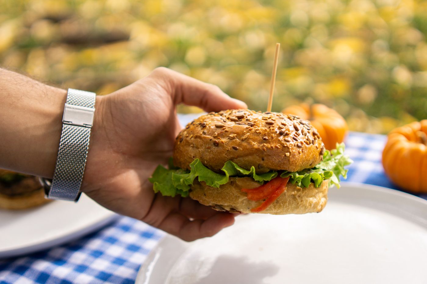 Gourmet veg burger with melted cheese and toppings
